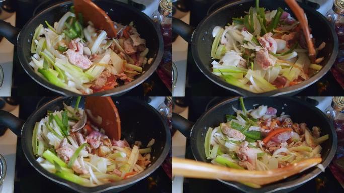 在厨房的煎锅里煮泡菜炒猪肉-韩国美食风格