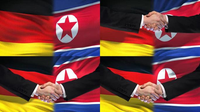德国和朝鲜握手，国际友谊，国旗背景