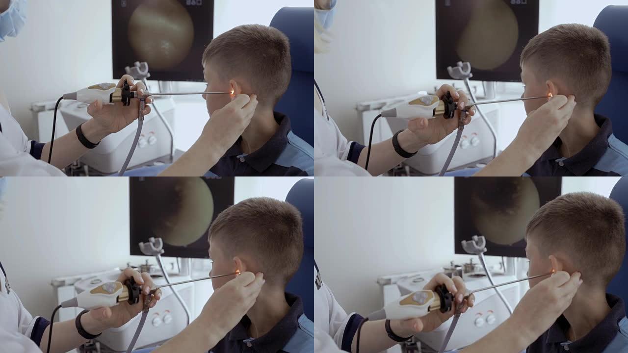 医生用耳鼻喉科望远镜检查孩子的耳朵