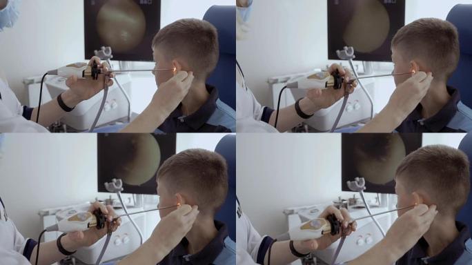 医生用耳鼻喉科望远镜检查孩子的耳朵