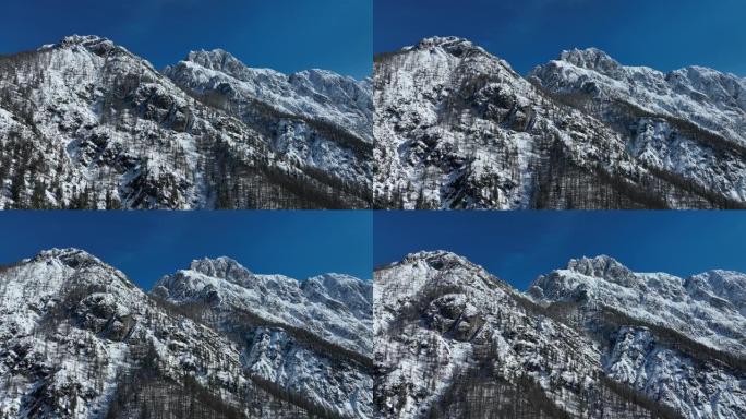 晴天空中无人机拍摄雪山链