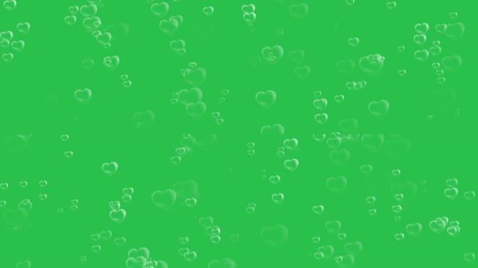 心形气泡在绿屏背景上的发射运动图形效果。