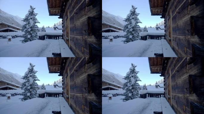 从山中一个白雪皑皑的村庄的小屋中可以看到广阔的视野