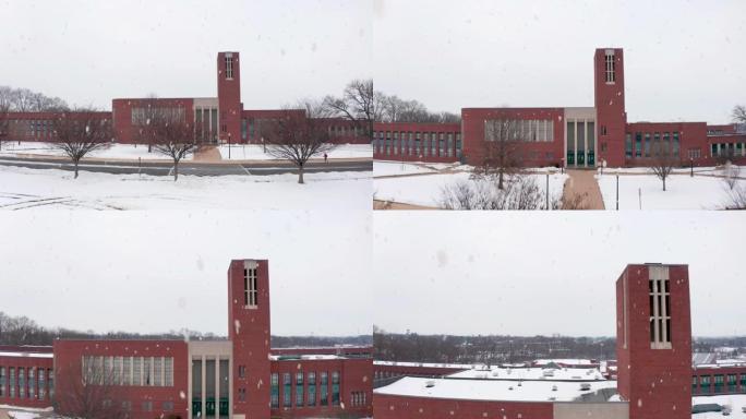 冬季暴风雪期间，大型砖砌学校、大学上升的无人机航拍。取消了学生的课程。