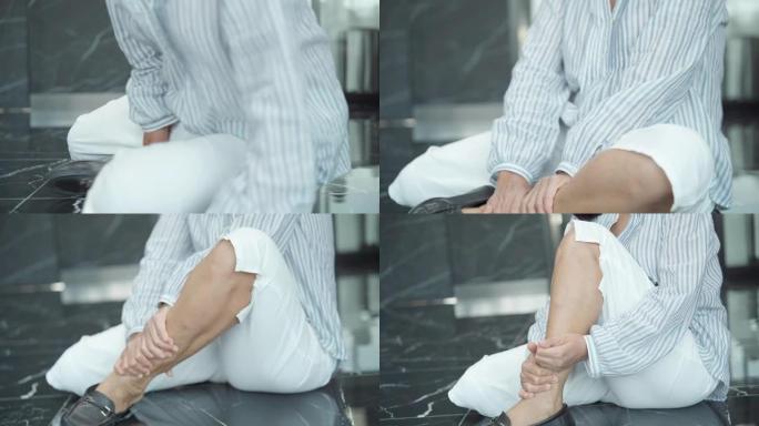 亚洲成熟女人走路和加重痛苦感觉受伤突然扭伤脚和关节肌肉拉伤