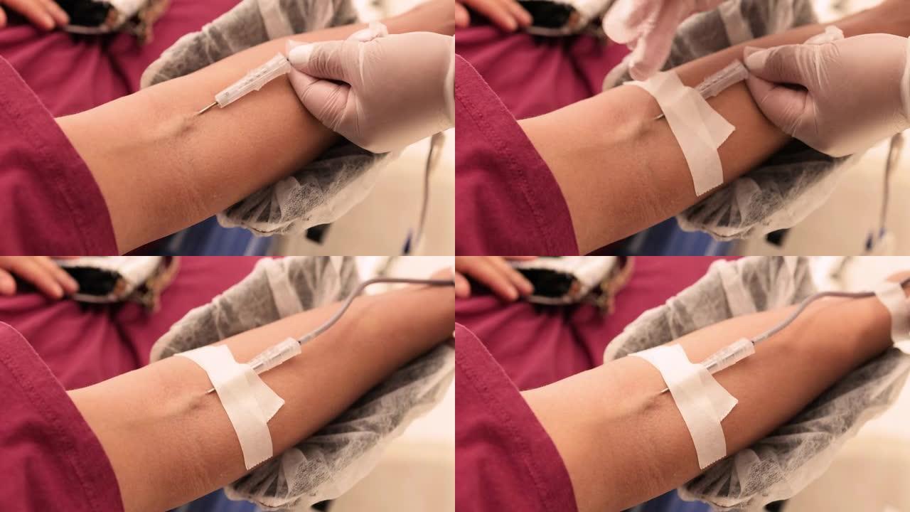 献血，护士在静脉中使用针头
