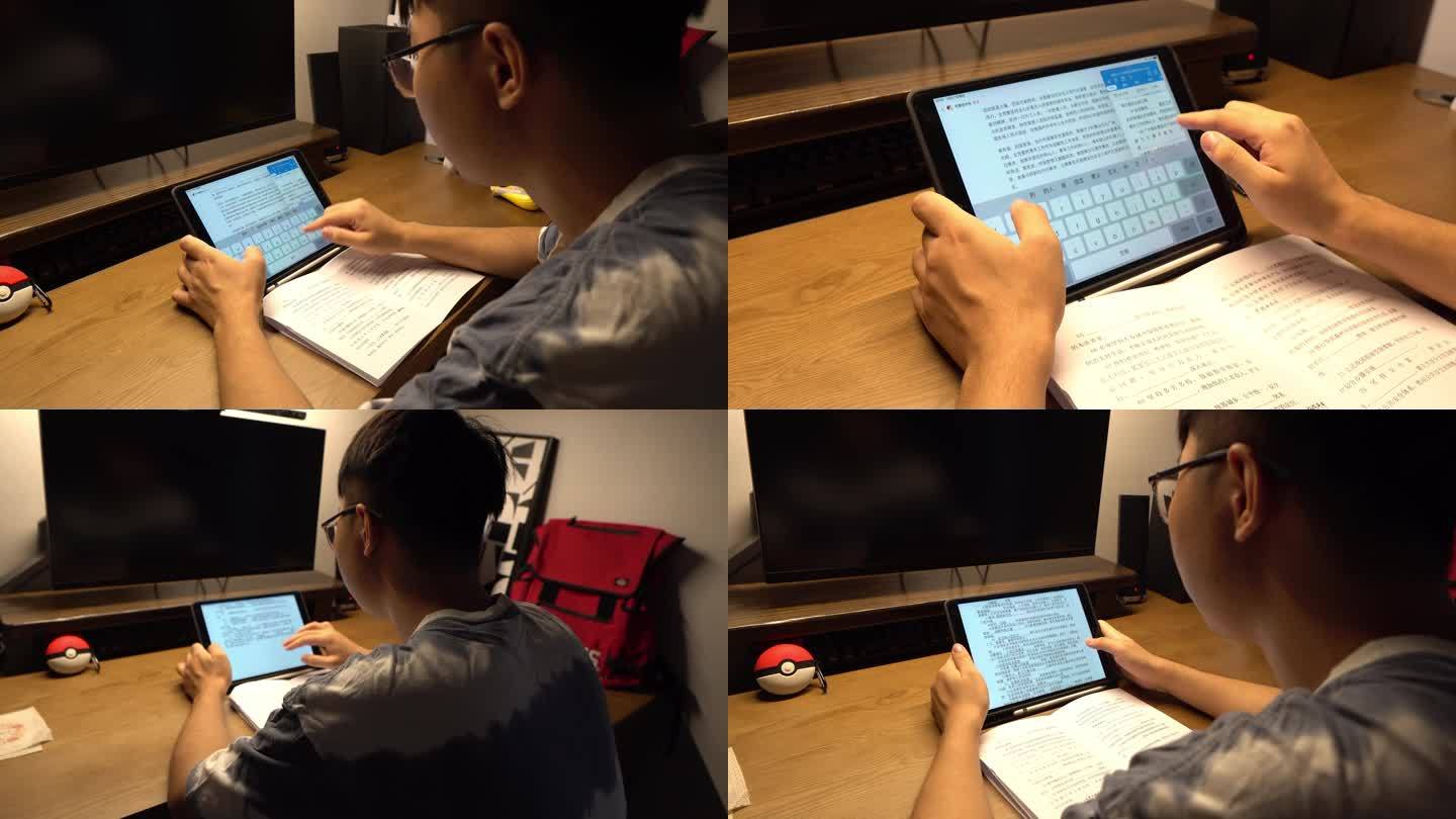 夜晚大学生在宿舍公寓使用平板电脑学习备考