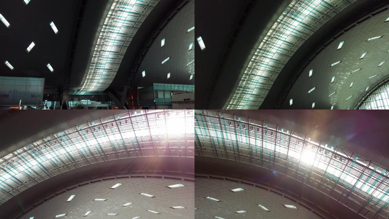 卡塔尔多哈哈马德国际机场现代航站楼的自然光在天花板建筑上闪耀，慢动作