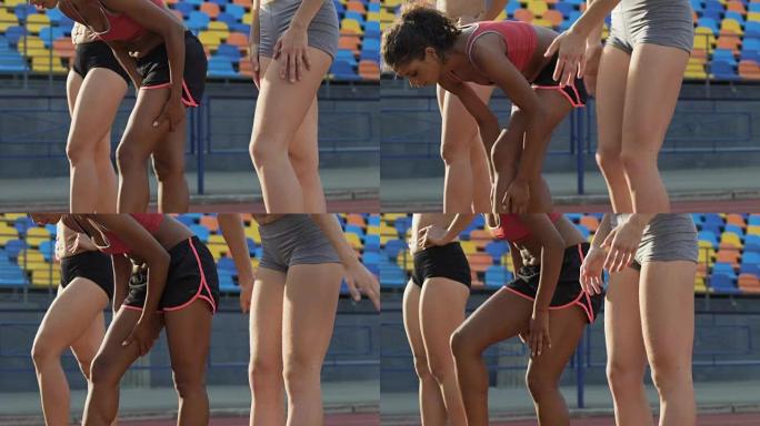 女运动员揉腿，准备肌肉，抗脂肪运动