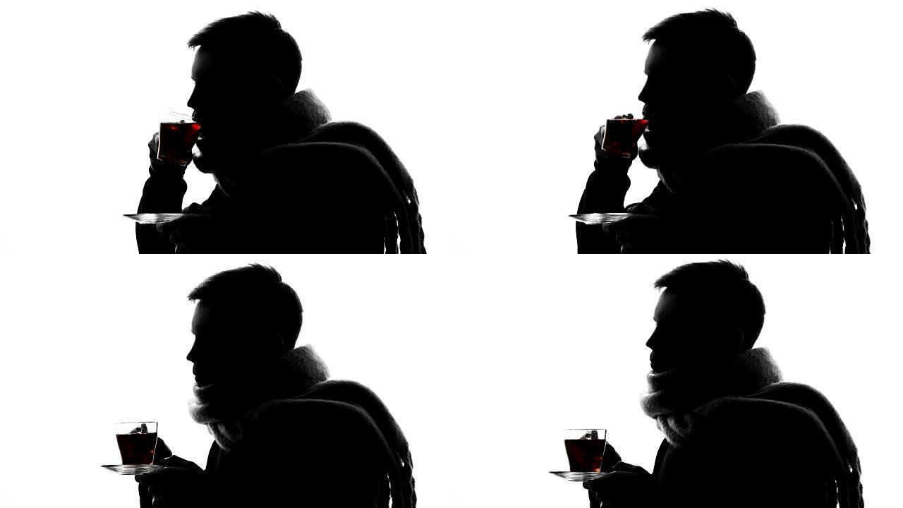 患有流感的男子在白色背景上喝热茶，喉咙疼痛，感染