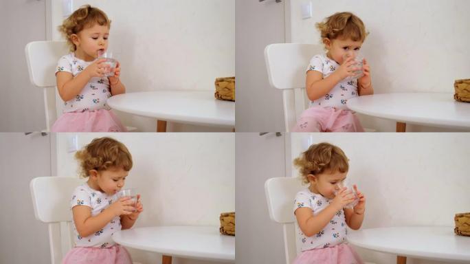 孩子从杯子里喝水。选择性聚焦。孩子。