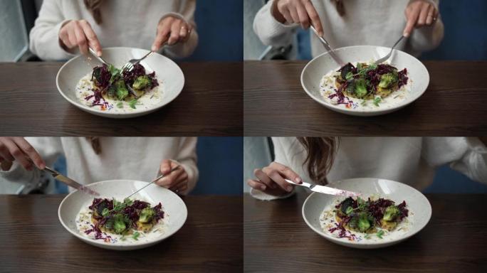 一个女人在吃高档蔬菜烩饭的特写镜头