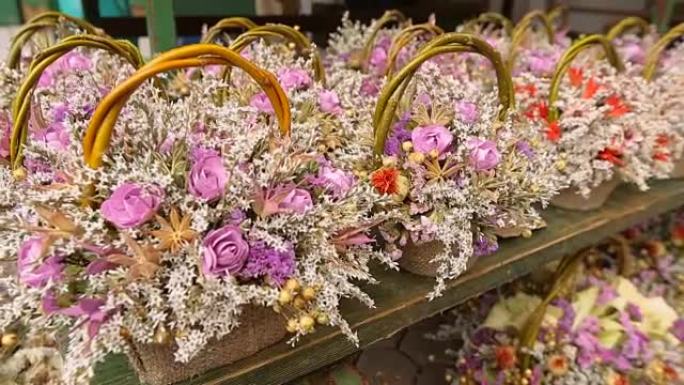 美丽的花束站在市场柜台，鲜花和植物，花店
