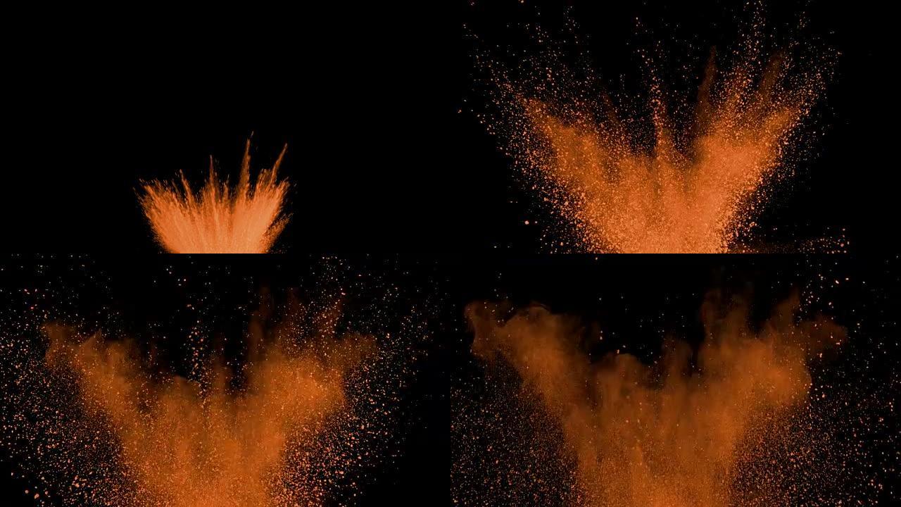 橙色粉末以超慢动作在黑色背景上爆炸