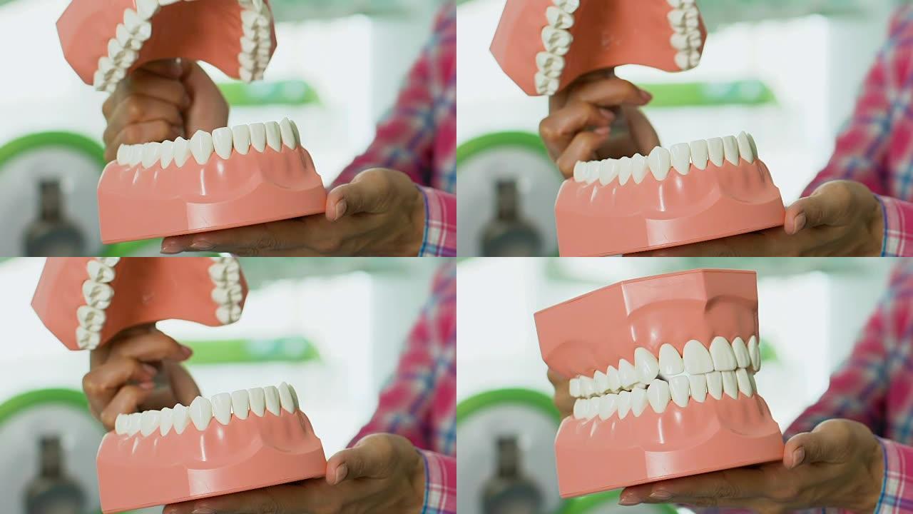 老师向孩子们展示下颌结构，学校的牙齿卫生课