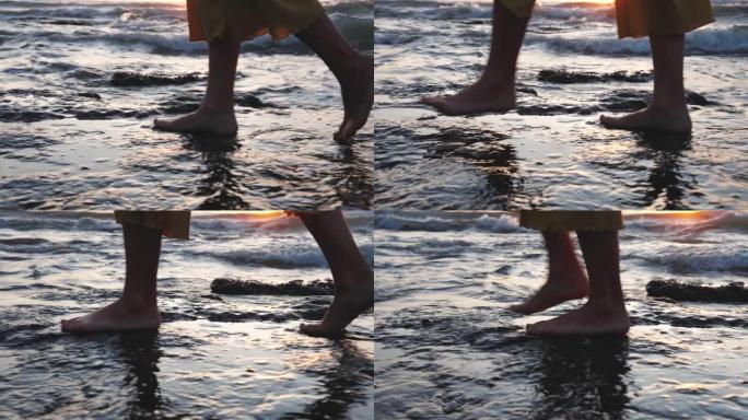 赤脚的女人在海洋自然的夏日海滩上散步。夏天度假时，漂亮的成年女孩赤脚在斯洛莫户外散步。天堂海景黎明时