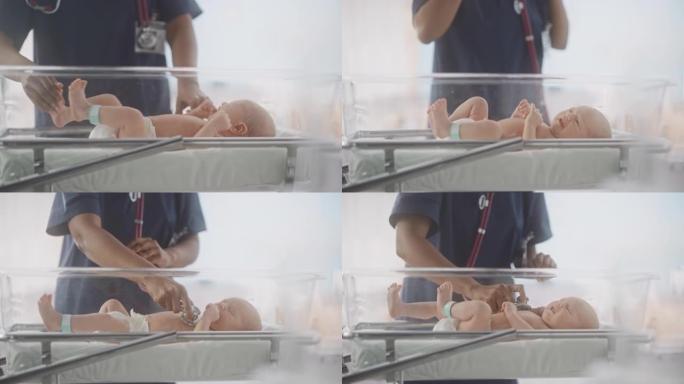 护士长使用听诊器聆听在产科医院病房摇篮中休息的新生儿的心跳和肺部。非洲儿科医生在托儿所对婴儿进行检查