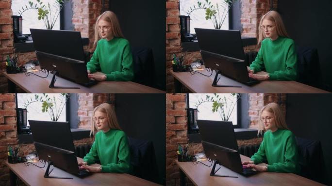 年轻女子在现代办公室工作，在笔记本电脑键盘上打字，女程序员