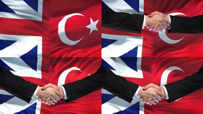 英国和土耳其握手，国际友谊，旗帜背景