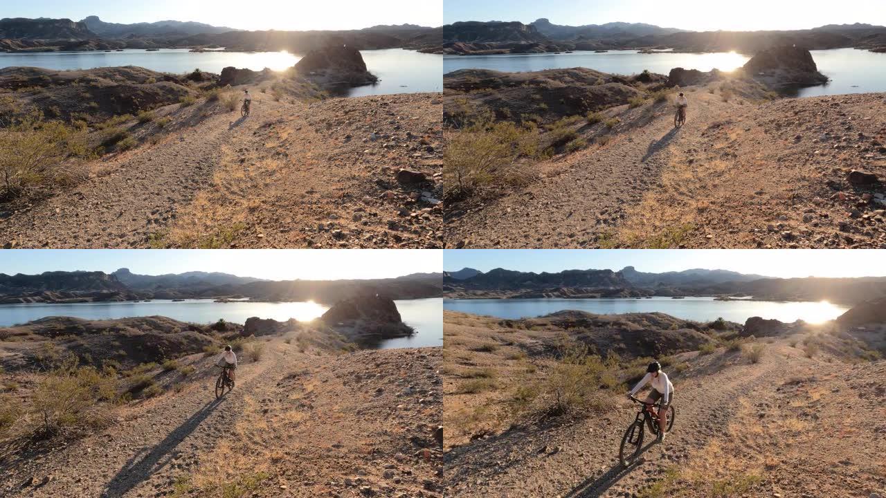 成熟的女自行车手登上沙漠轨道