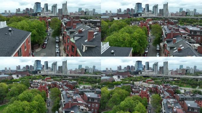 Rising aerial揭示了公寓房屋和房屋以及马萨诸塞州波士顿市中心的天际线。扎基姆邦克山桥。