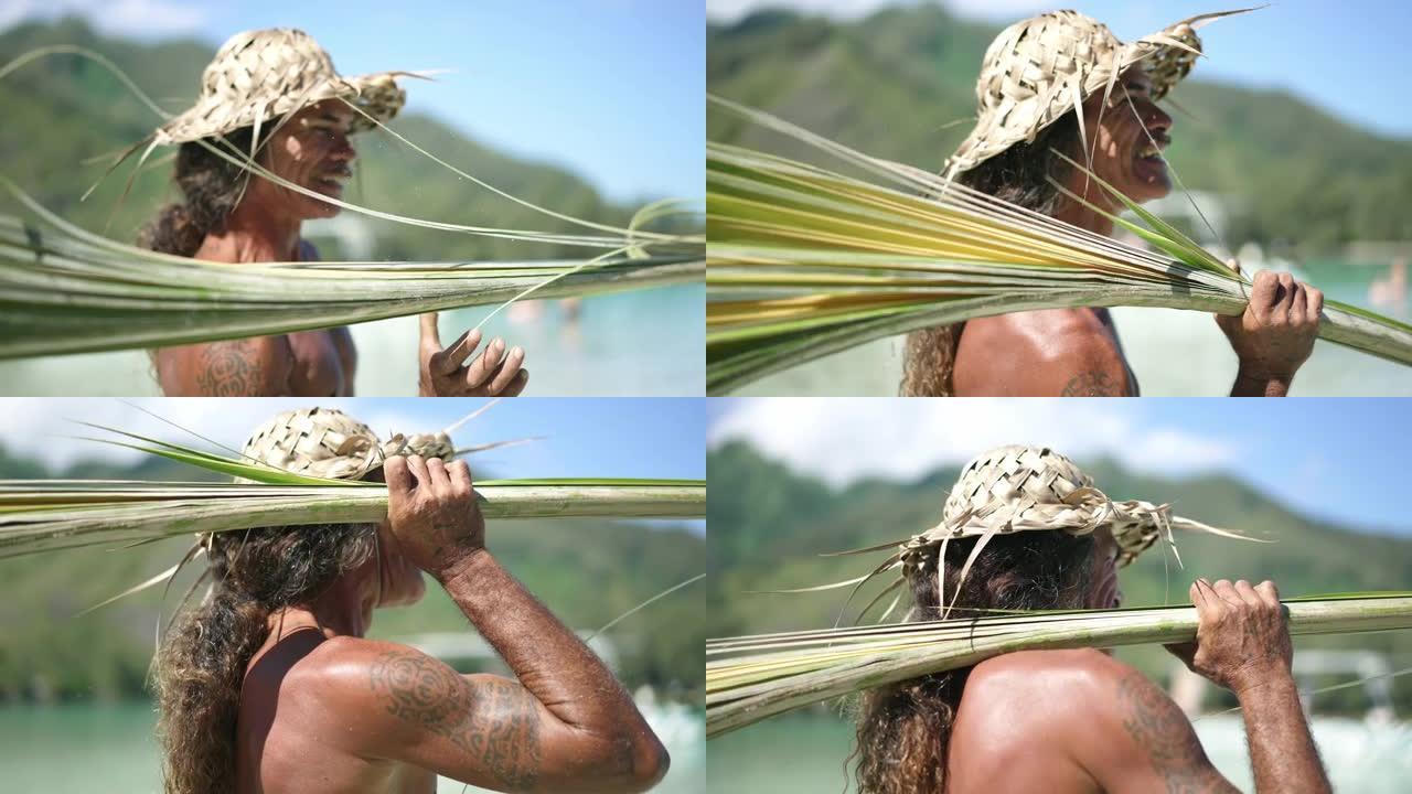 传统大溪地男子在大溪地波拉波拉旅游时制作椰子棕榈叶帽。法属波利尼西亚。