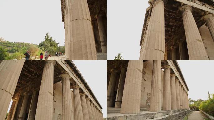 一群高级游客观看古代寺庙的大理石柱子