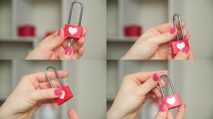 情人节概念，为情人锁在女人的手中，打开钥匙