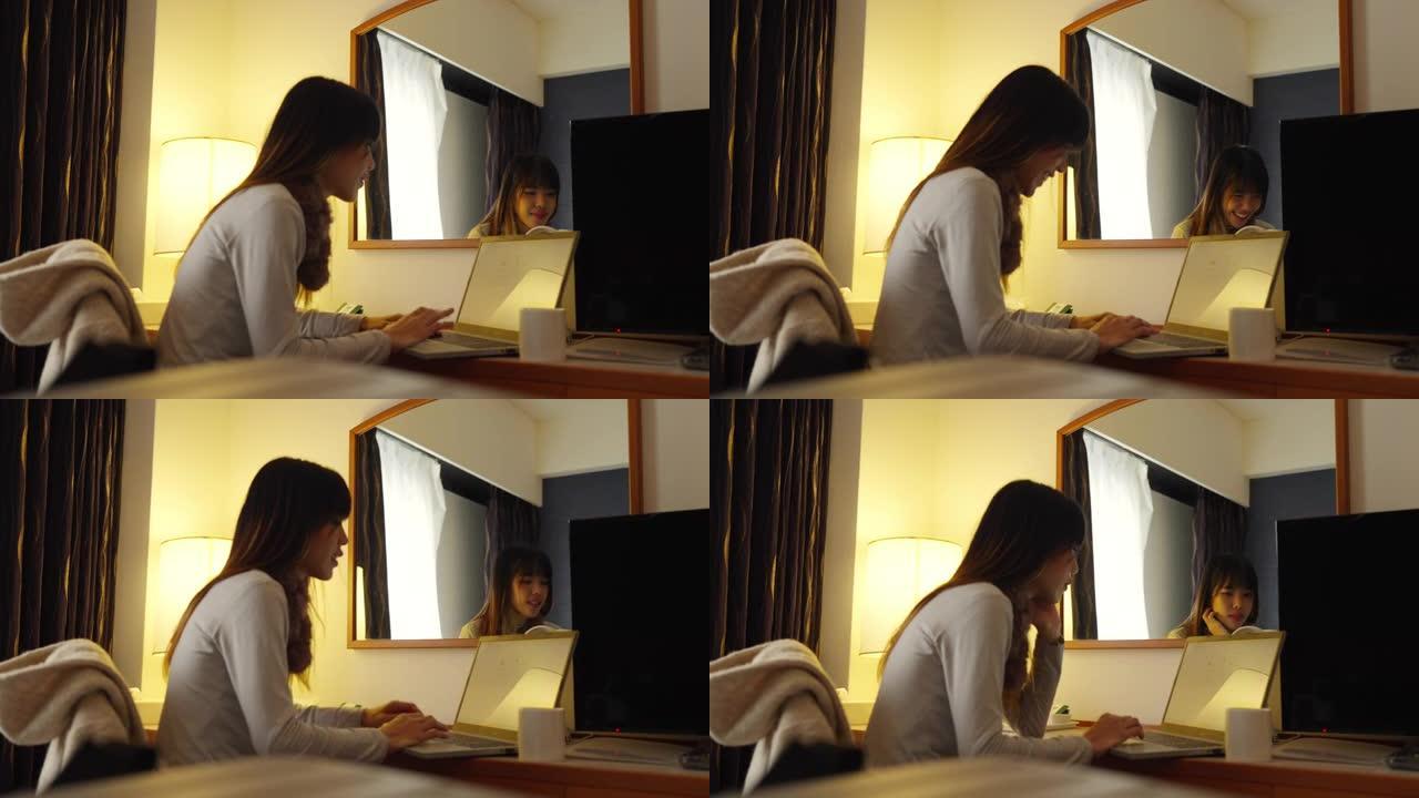 4k亚洲女性在酒店房间里使用笔记本电脑。