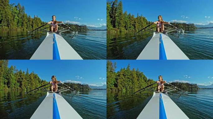 POV女运动员在阳光普照的湖上双桨