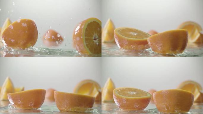 橙子击中橙汁表面并分成两半。慢动作镜头