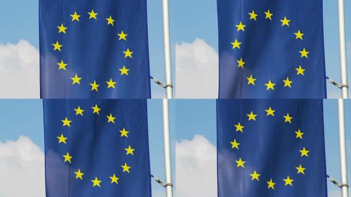 欧盟旗帜迎风飘扬，蓝天为背景