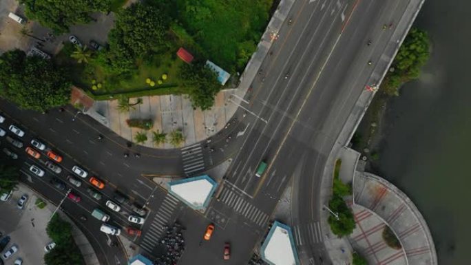日落三亚城市景观滨江交通道路空中俯视图4k海南中国
