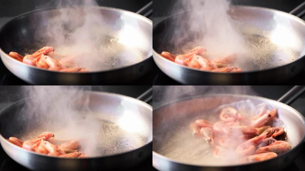 厨师把虾扔在烤架上。大虾在平底锅里煎炸的特写镜头。厨师在热锅上煎皇家虾。宏观海洋食品制备