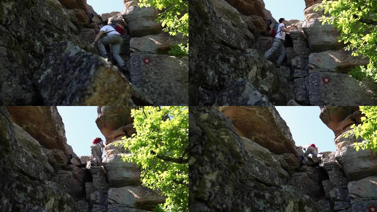 为了达到他的远景，徒步旅行者在极端的岩石地形上占上风