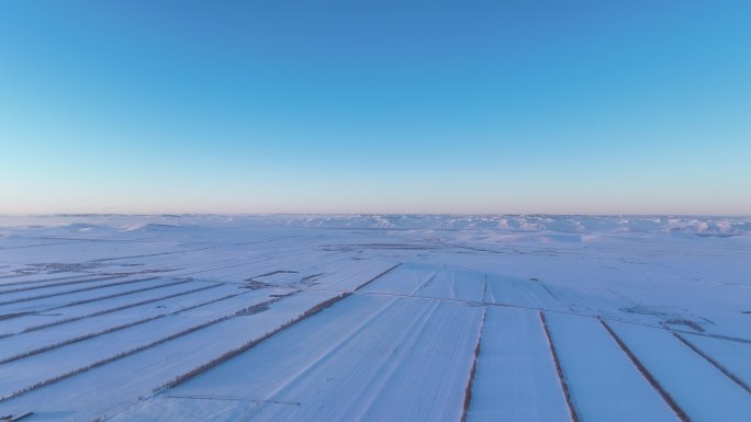 航拍4K内蒙古垦区田野雪景夕照