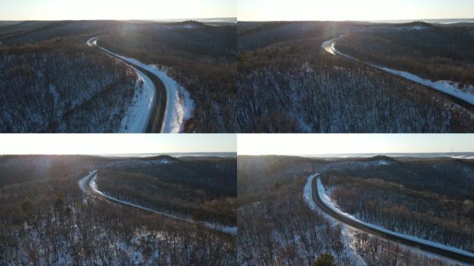 4K航拍下雪后的山公路高视角