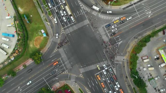 日落三亚城市景观河畔交通十字路口空中俯视图4k海南中国