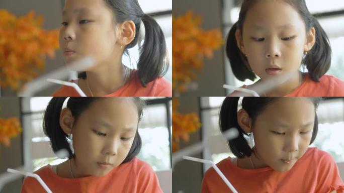 亚洲女孩吃日本食物，在餐馆和家人聊天，生活方式理念。