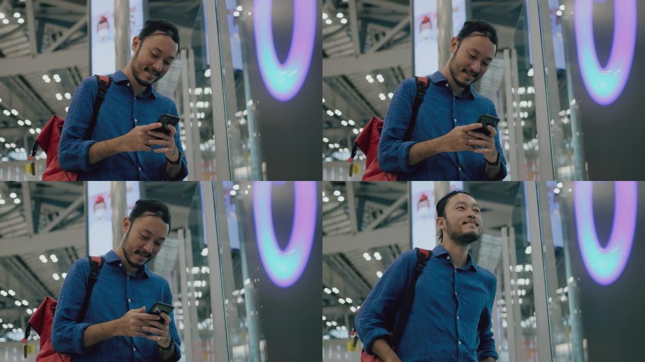 年轻的成年男性游客在机场等待办理登机手续时通过智能手机进行规划-股票视频