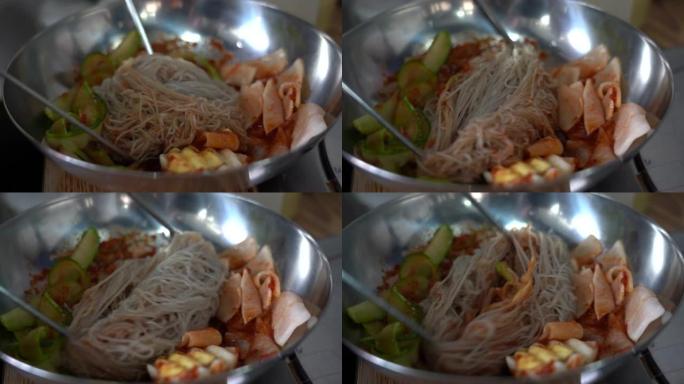 韩国冷面; naengmyeon。黄瓜切片，腌萝卜。美味的食物