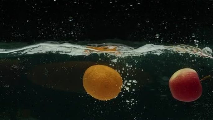 橙子和苹果掉入水中，慢动作，prores 422，bmpcc4k
