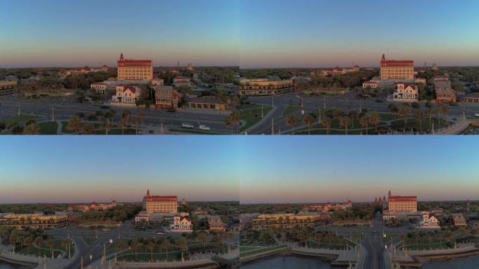 日出时佛罗里达州圣奥古斯丁的空中天际线。狮子桥和马坦萨斯河上历史悠久的市中心的远景。