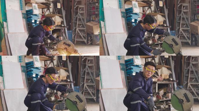 亚洲中国男性蓝领工人微笑着看着车间车库的镜头