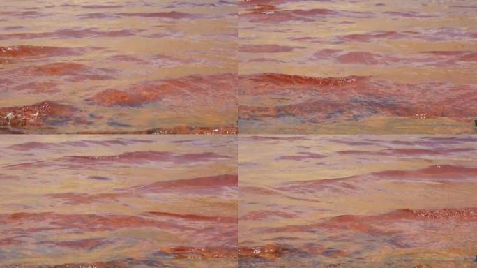 红色酸性矿山排水4k镜头的波浪水