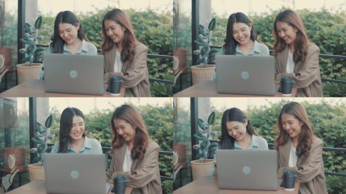 亚洲妇女在绿色办公空间的办公桌上使用笔记本电脑和数字平板电脑。