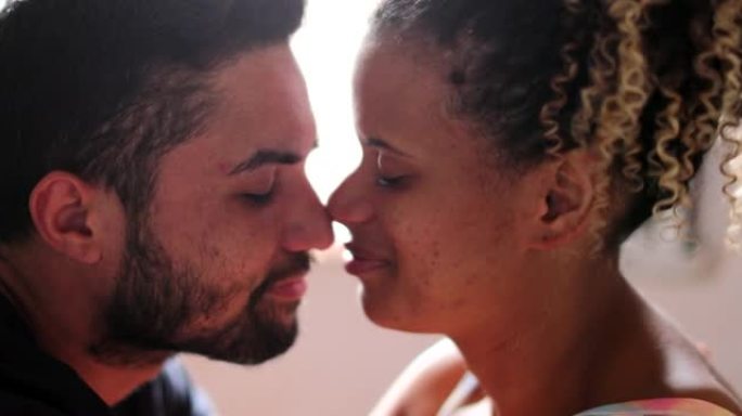 西班牙裔夫妇爱斯基摩人之吻。拉丁美洲男人和女人拥抱