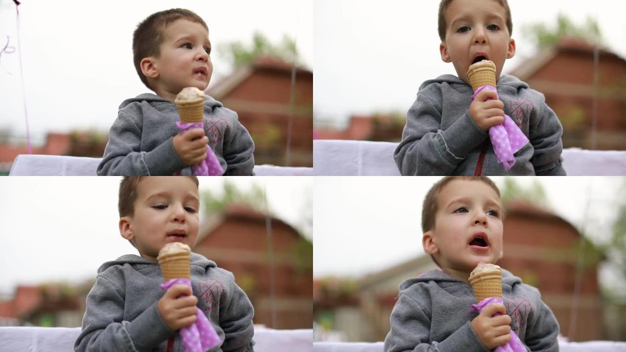 可爱的小男孩在后院吃冰淇淋