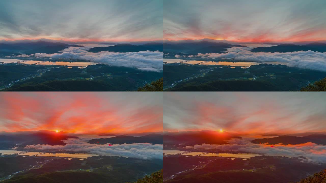 雾蒙蒙的日出早晨在市外的夜滨山顶视图。在南阳州市韩国