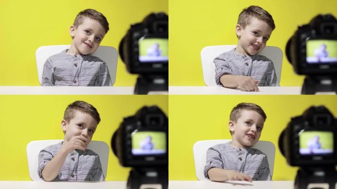 儿童博客在家里录下他的视频博客。男孩录制他的视频博客。小视频记录器使用相机进行在线流媒体。